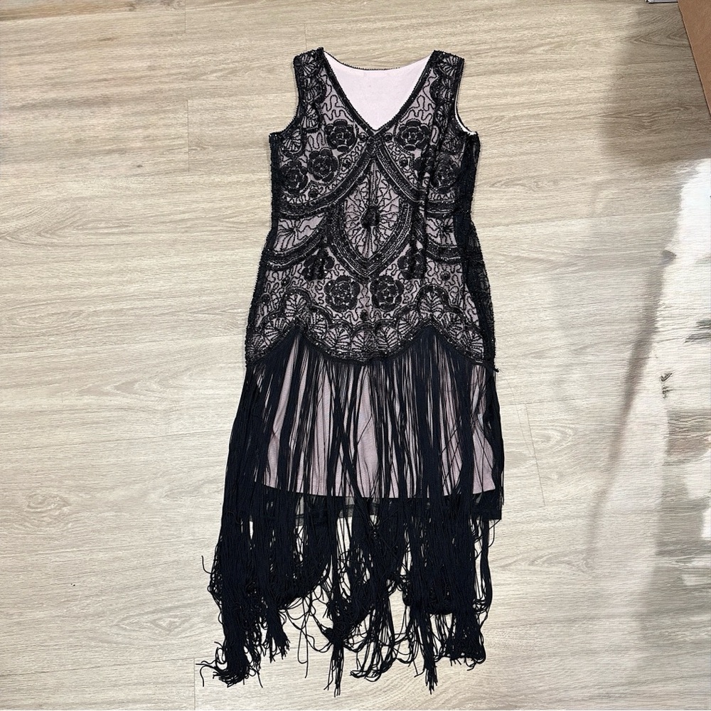 black beaded, flapper-style cocktail dress with a fringed hem floral